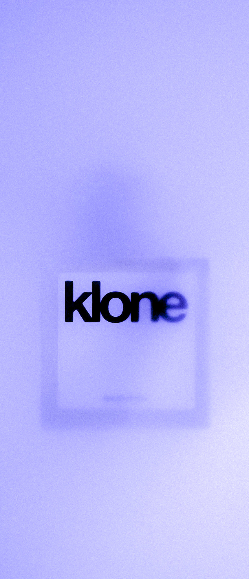 KLONE perfume bottle on purple background, featured on mobile banner for mood-driven fragrances.