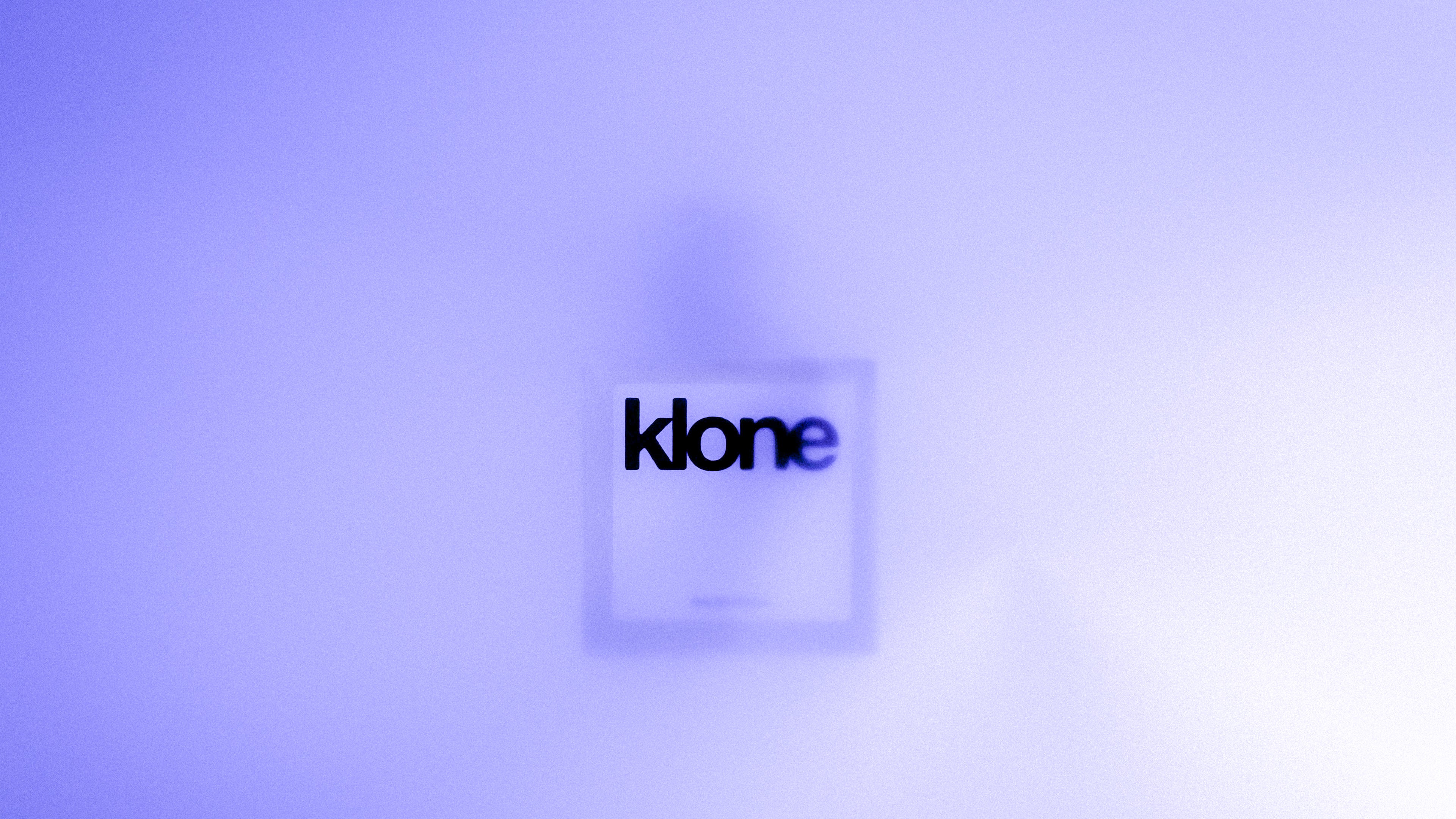 KLONE perfume bottle on purple background, representing our mood-driven fragrances for every emotion.